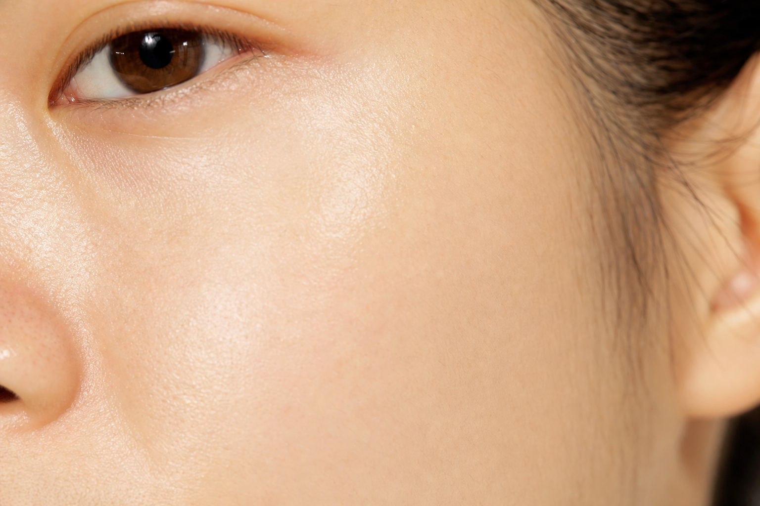 Close-up of smooth luminous skin after a spring exfoliation reset, representing healthy skin texture, Belldiva skincare