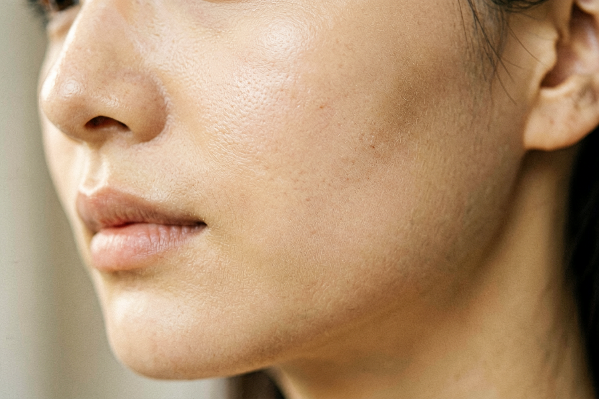 Close-up of luminous healthy skin in warm morning light, representing skin barrier repair and skin resilience, Belldiva